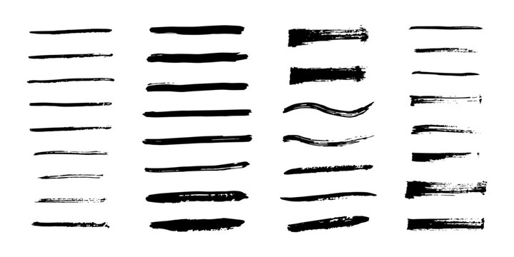 A set of black ink brush strokes, hand drawn lines and blurs of varying thickness, isolated on a white background