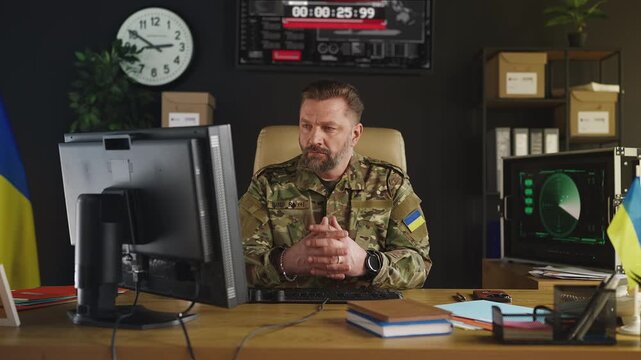 Portrait of Ukrainian intelligence officer planning covert operation in office