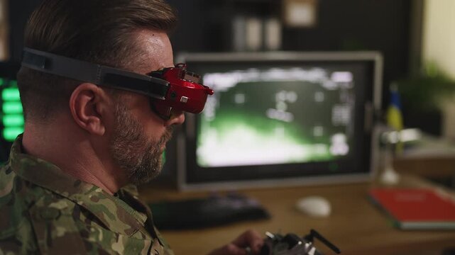 Male pilot practicing tactical FPV drone control in Ukrainian command center