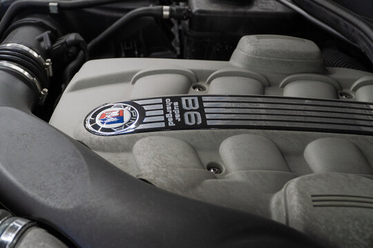 V8 engine of BMW ALPINA E63 Under the bonnet sits a supercharged 4.4-litre V8, delivering 500hp, 516lb-ft of torque. Engine motor of BMW ALPINA E63, E64 B6 with emblem close-up. BMW ALPINA E63, E64. 