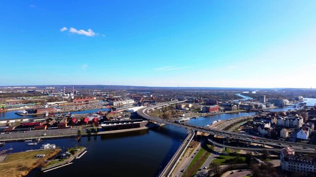 Wide aerial panorama of Szczecin city skyline and Oder river.