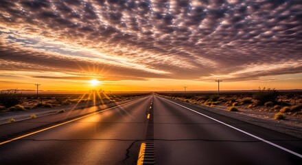 Obraz premium An open road leading toward the rising sun with strong sunlight flare and textured clouds, symbolizing journey, travel, and new beginnings.