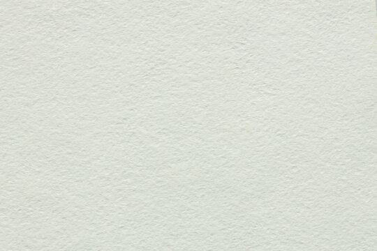 Soft white watercolor paper texture background with fibrous surface for minimal clean artistic backdrop