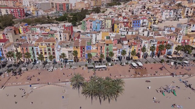Lateral drone movement over Villajoyosa colorful coastal city