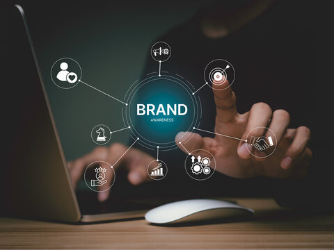 Brand awareness strategy concept, businessman touch digital brand awareness icons, communication, target, Marketing growth, customer loyalty, and partnership symbols for corporate branding success