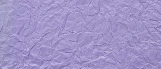 Fototapeta premium Crumpled purple paper texture with wrinkled surface creating abstract pattern background