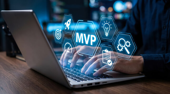 Businessman working on laptop with digital holographic interface showing mvp concept for product development