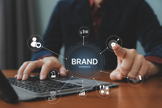 Brand awareness strategy concept, businessman touch digital brand awareness icons, communication, target, Marketing growth, customer loyalty, and partnership symbols for corporate branding success