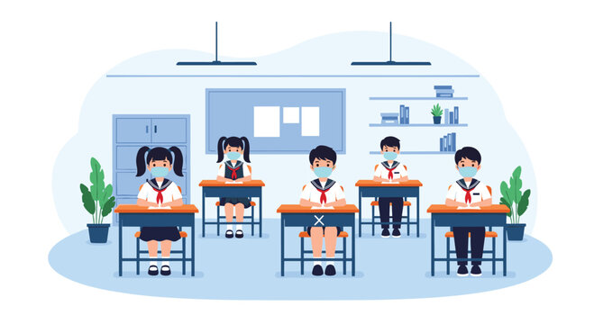 Group of school children sitting at their desks and wearing face masks in a classroom to maintain health safety.