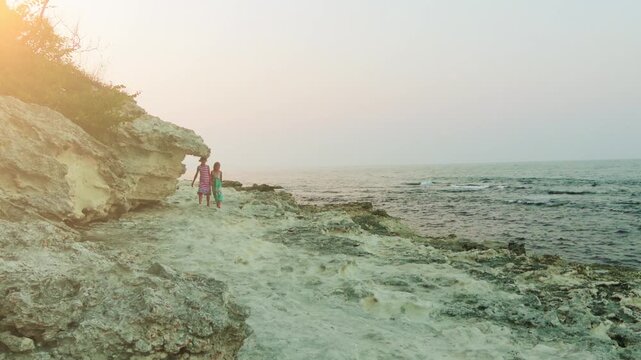 Two little girls walk near Tsarevo in Bulgaria