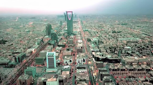 Panoramic Drone View of Riyadh City Skyline Featuring Kingdom Centre and Urban Traffic