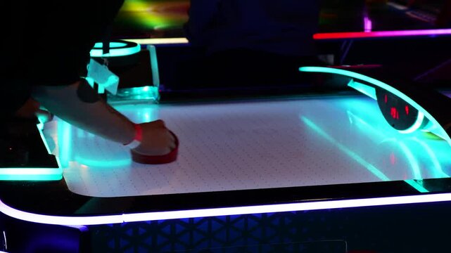 Fast-Paced Air Hockey Game in a Neon-Lit Arcade Environment