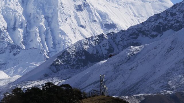 Helicopter flying with Snowy Himalayan Mountain Peaks in the background, Nepal