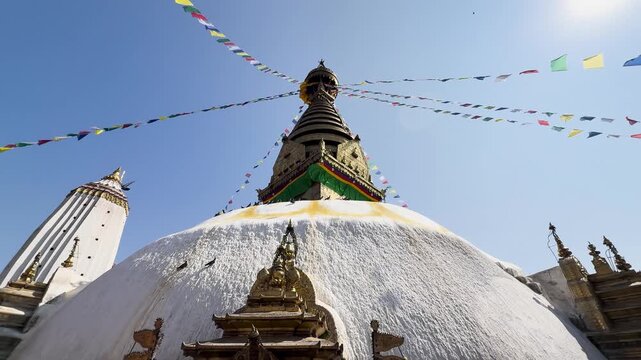 Swayambhunath Stupa with Prayer Flags and Birds in Kathmandu City, Nepal