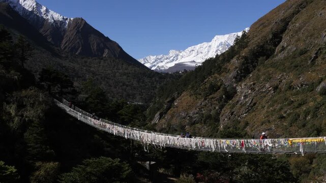 Long Suspension Bridge over a River in the Himalaya Mountains, Nepal