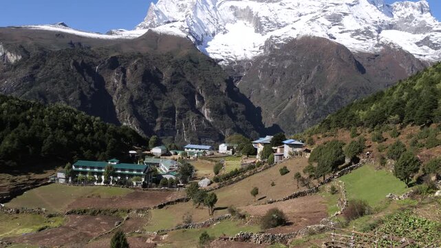 Remote Himalayan Village with Snow-Capped Mountain Backdrop, Nepal