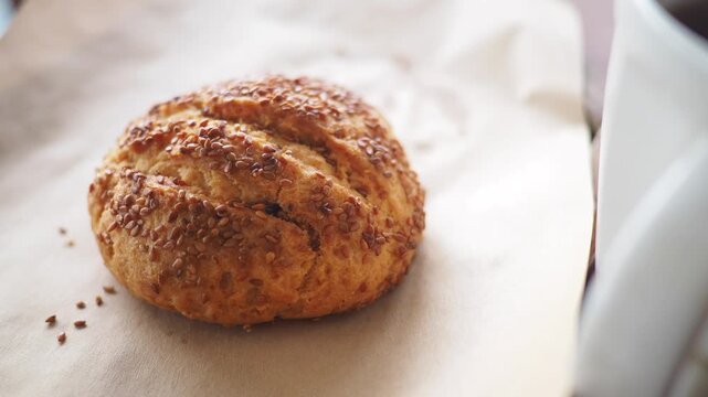 Baking sesame bread roll with coffee at morning time