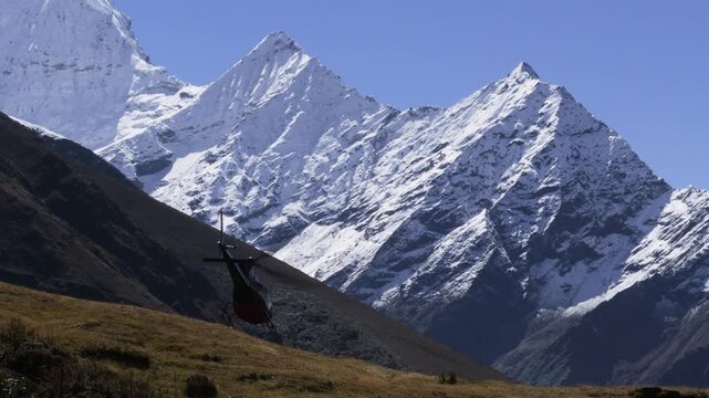 Rescue Helicopter Flying Over a Himalayan Mountain Pass, Nepal