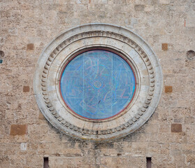 Naklejka premium Rose window with abstract stained glass, San Gimignano, Italy