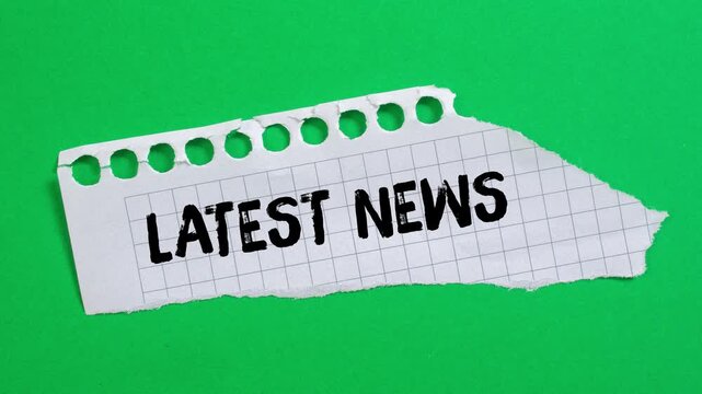 Latest news message writing on ripped torn paper background
