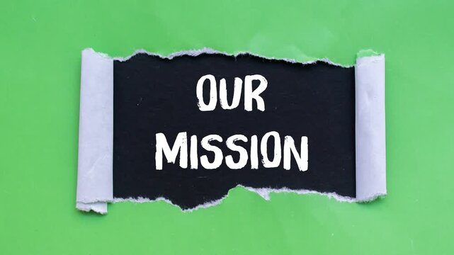 Our mission message writing on ripped torn paper background