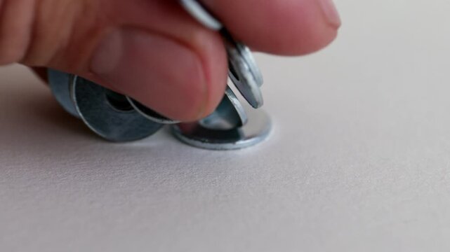 Flat Metal Washers on White Background Close Up Industrial Hardware Set
