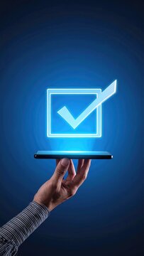 Hand Holding Smartphone with Floating Checkmark Icon.