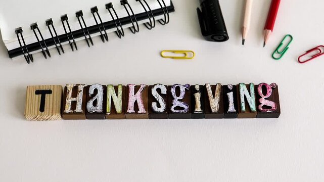 Thanksgiving Text on Wooden Blocks with Office Supplies Flat Lay