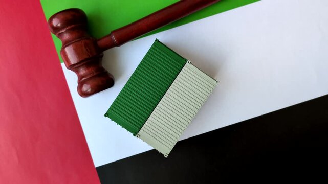 The cargo container ban on the UAE flag as a conceptual backdrop for the export and logistics of goods. The cargo container embargo on the UAE flag as a backdrop for your design