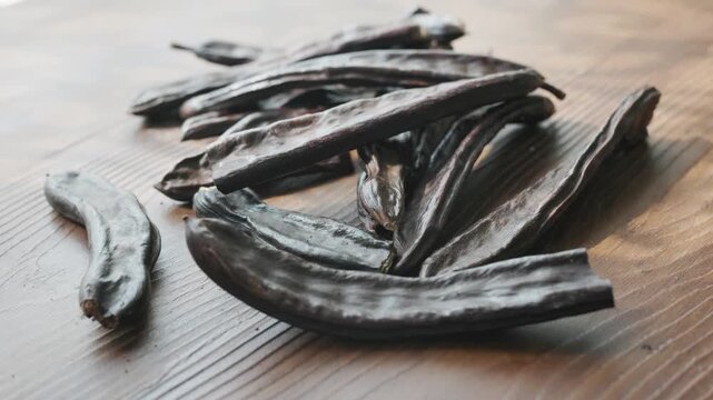 Close-up of Dried Carob Pods on Table