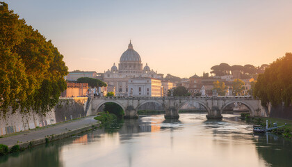 Fototapeta premium Saint Peters Basilica and Tiber River at sunrise in Rome.