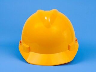 Fototapeta premium Safety hardhat isolated on blue background