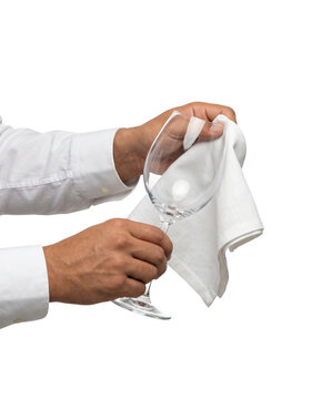 Bartender hands polishing a clean wine glass with a white cloth