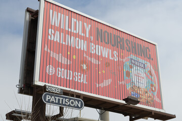 Naklejka premium roadside tri-vision billboard, advertising Gold Seal fish products on Lake Shore Blvd E, Toronto