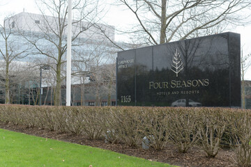 Naklejka premium stone road-side sign outside global headquarters of Four Seasons Hotels at 1165 Leslie St; a Canadian-founded luxury brand managed from Toronto, April 2026