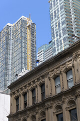 Naklejka premium elegant stone facade of Consumer's Gas Company, designed by Grant & Dick, located at 19-23 Toronto St, contrast with recent condominium, Toronto
