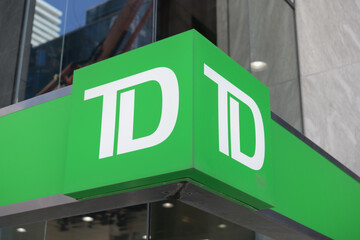 Obraz premium corporate logo of Toronto Dominion bank sign outside a branch in Toronto
