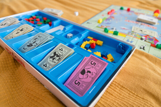 Organized Monopoly game box with pieces and money