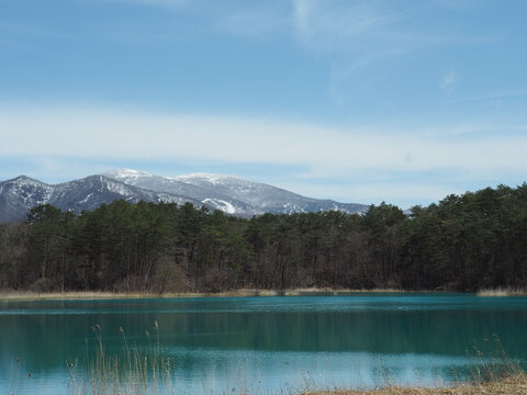 A tranquil spring landscape of Goshiki-numa Ponds in Kitashiobara, Fukushima, featuring mystical volcanic ponds and calm natural scenery in late April.