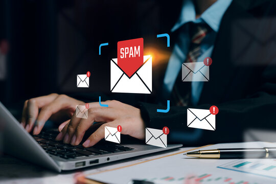 email security protection, professional typing on laptop with spam warning envelopes interface, cybersecurity filtering and phishing prevention concept