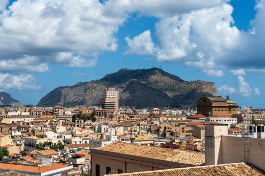 panoramic view of the rooftops of Palermo, with Mount Pellegrino in the background.