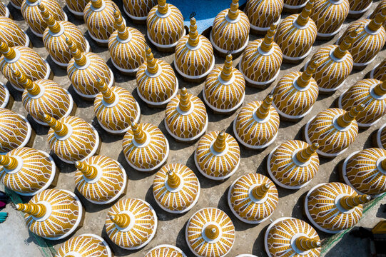 Aerial view of golden-domed structures, intricately patterned, forming a vibrant mosaic across a sunlit surface, Tangail, Dhaka Division, Bangladesh.
