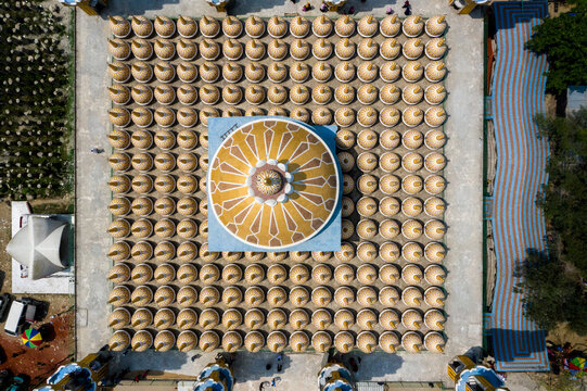Aerial view of the meticulously arranged domes creating a mesmerizing geometric pattern around the central structure, a symphony of symmetry and design, Tangail, Dhaka Division, Bangladesh.