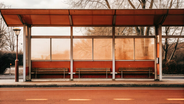 Dark rainy night with heavy rain cascade concept. A quiet bus stop with empty benches surrounded by trees.
