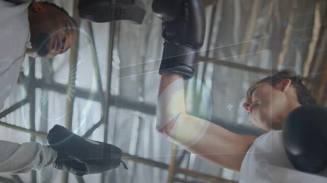 Trainer holding mitts, shifting targets cueing boxer throwing jabs and crosses for boxing timing