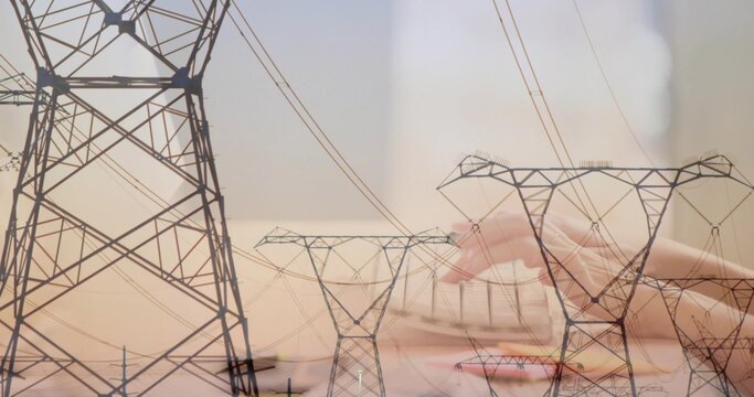 Combining power pylons and HV lines with hands writing on papers in light long sleeve