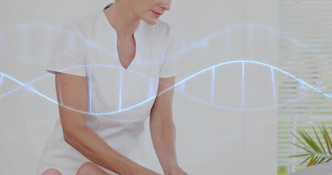 Leaning clinician in white tunic examining patient legs on clinic table, with DNA helix overlay