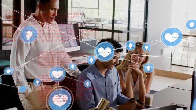 Tech team reviewing, seated man typing and launching growing overlay with heart pin bulb icons