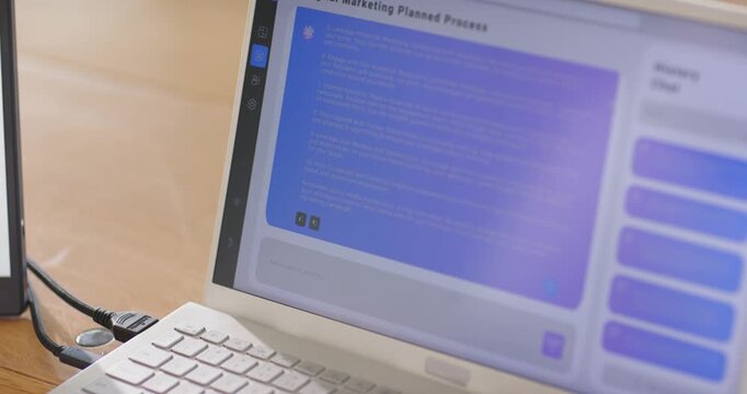African American man tapping and swiping laptop screen on desk, responding to History Chat prompt