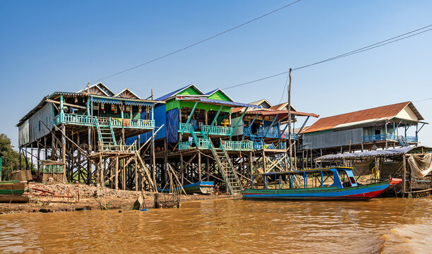 Tonle Sap Lake, Siem Reap, Cambodia &ndash; Traditional fishermen's houses built on stilts on the muddy banks of the Siem Reap River near Tonle Sap Lake.